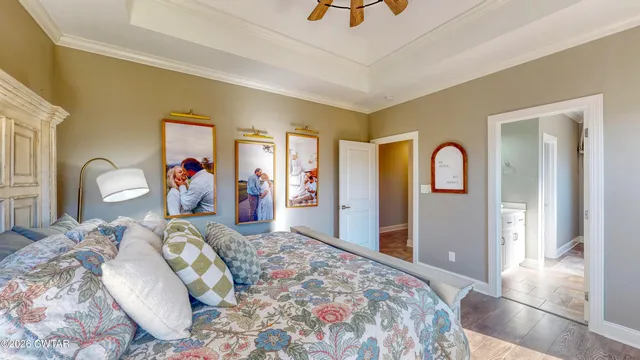 a bedroom with bed and a mirror