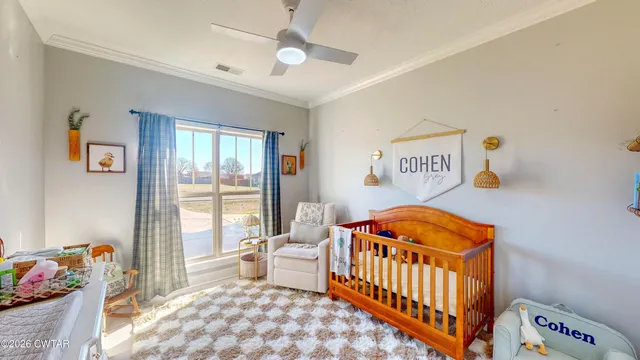 a bedroom with furniture and a window