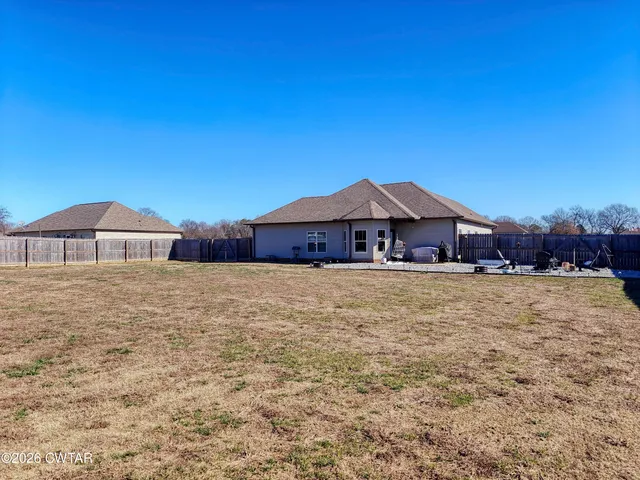 a view of balcony with wooden floor