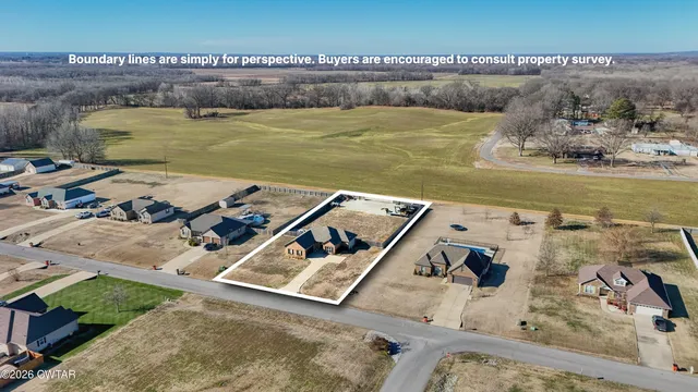 an aerial view of a house with a ocean view