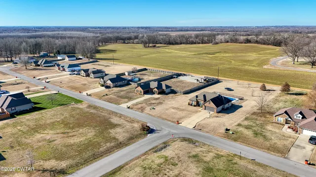 an aerial view of a building with ocean view