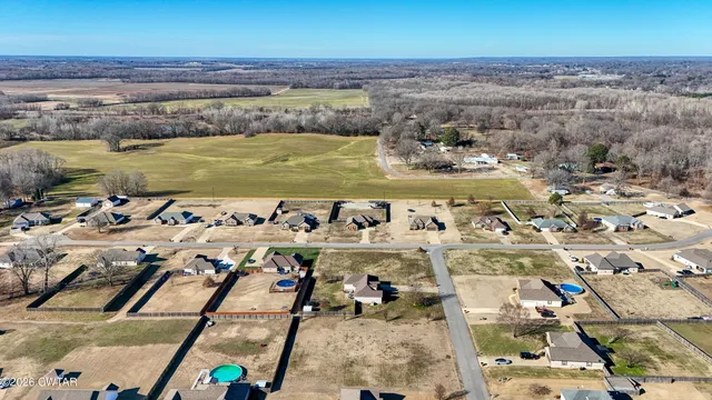 an aerial view of a building with ocean view