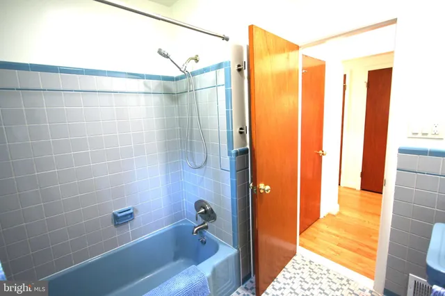 a bathroom with a sink and shower