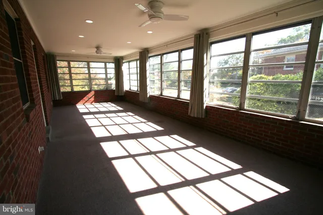 a view of a livingroom with a refrigerator