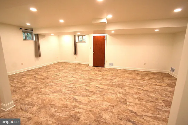 a view of a storage & utility room with two washing machine