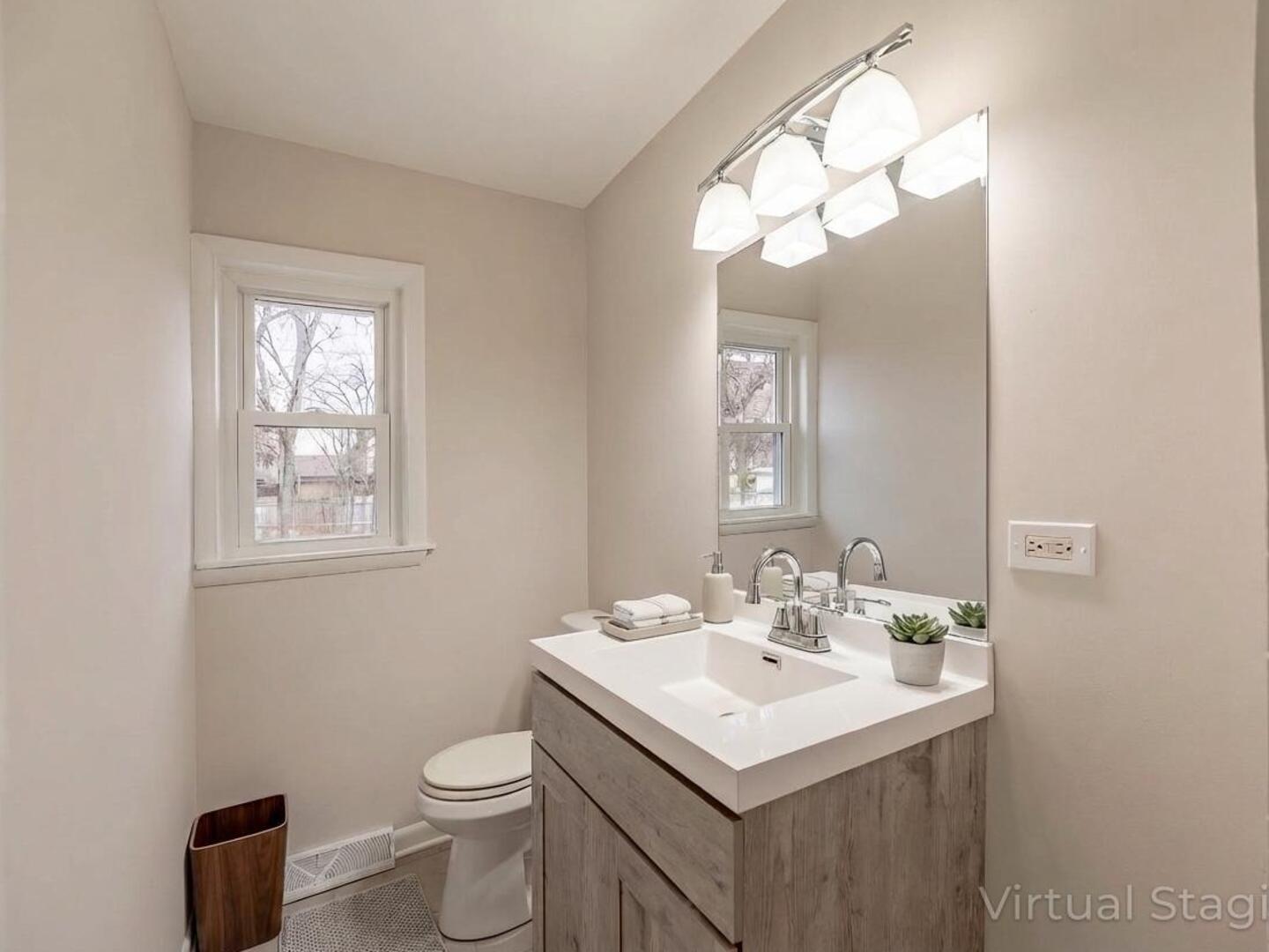 18331 Hickory Street Lansing, IL 60438 - Photo 4 of 12 a bathroom with a sink and a mirror