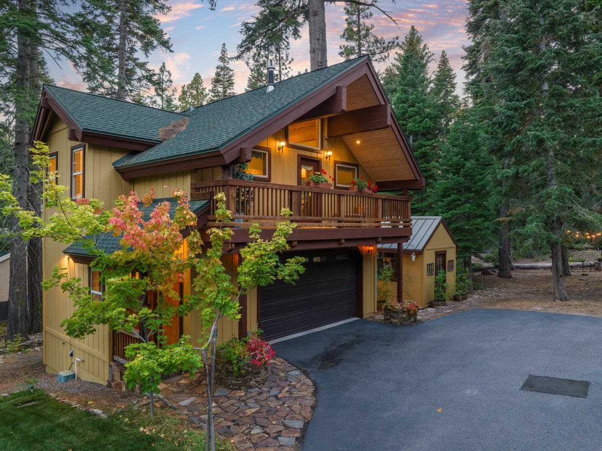 4465 North Ridge Road Carnelian Bay, CA 96140 - Photo 25 of 28 a view of a house with a yard and plants