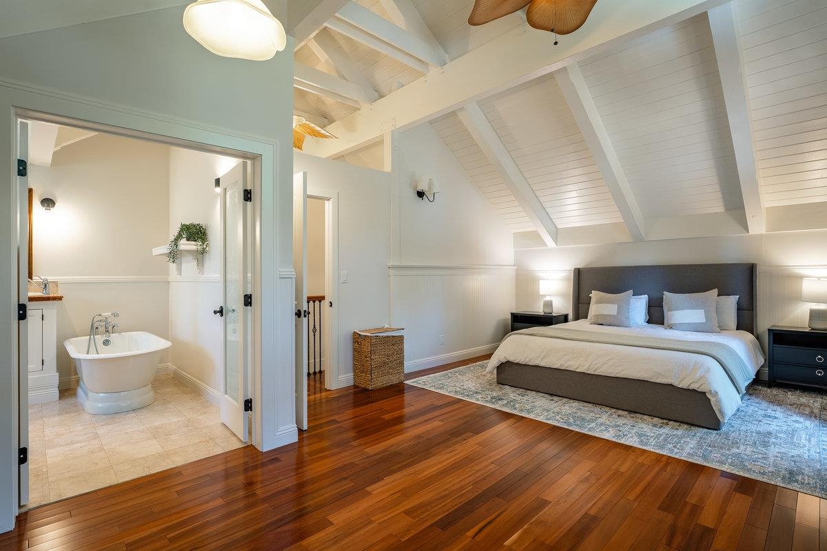 4465 North Ridge Road Carnelian Bay, CA 96140 - Photo 6 of 28 a spacious bedroom with a bed and a potted plant