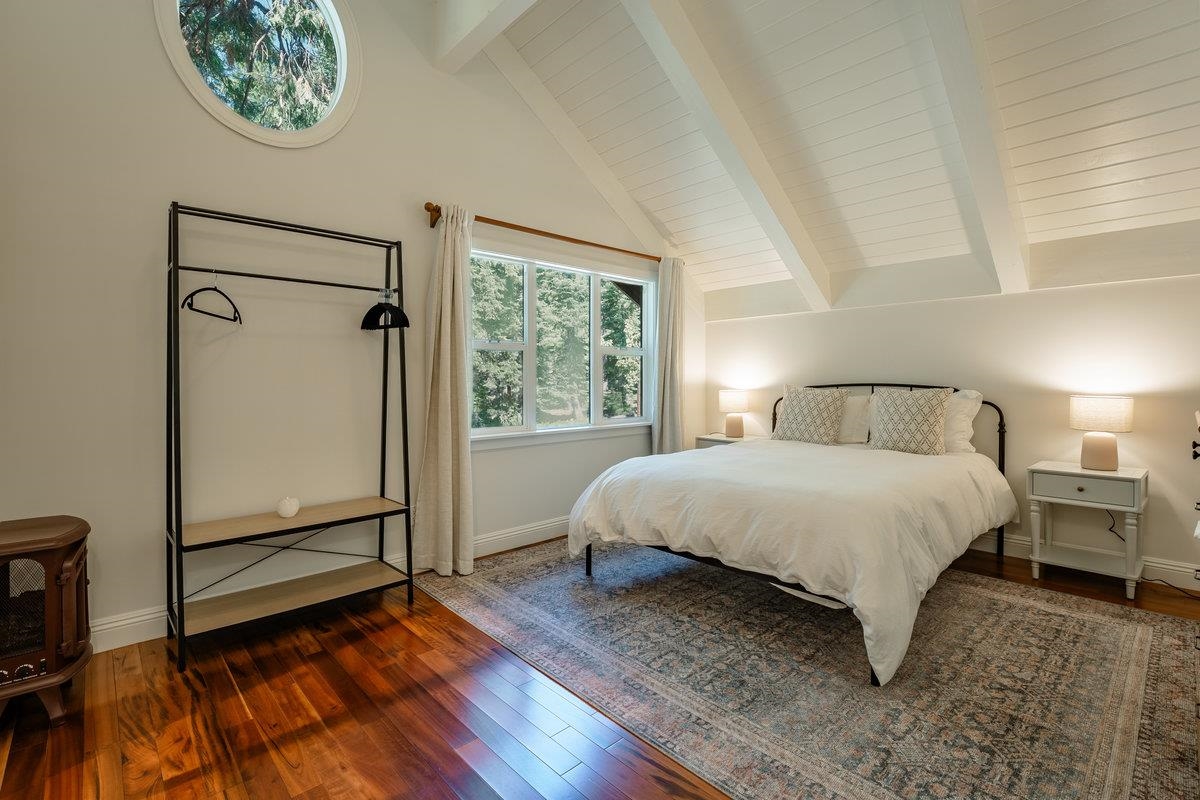 4465 North Ridge Road Carnelian Bay, CA 96140 - Photo 9 of 28 a bedroom with a bed and a window