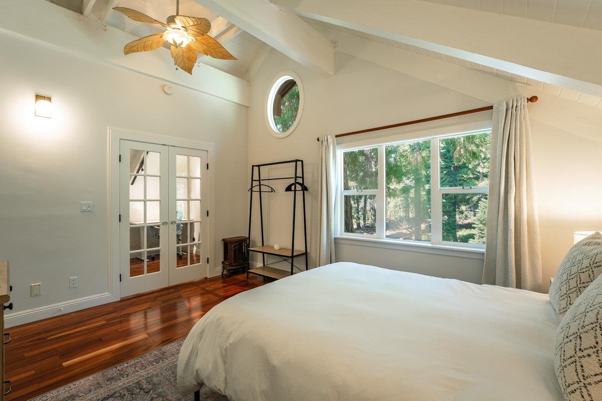 4465 North Ridge Road Carnelian Bay, CA 96140 - Photo 10 of 28 a bedroom with a large bed and a window