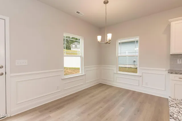 a view of a kitchen with a sink and cabinets