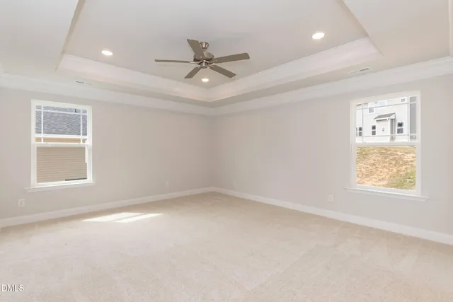 a white bath tub sitting next to a window