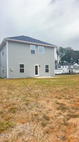 a swimming pool with trees in the background
