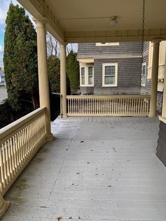 22 Hidden Road Andover, MA 01810 - Photo 10 of 41 a view of a porch with a floor to ceiling window