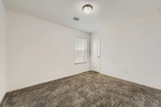 an empty room with window