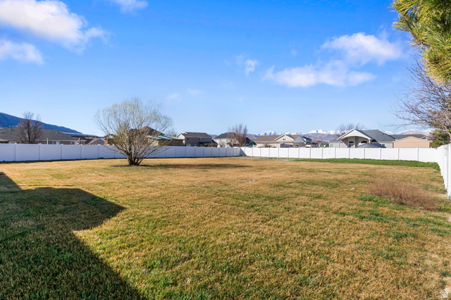 13176 Day Court Draper, UT 84020 - Photo 35 of 45 Fenced backyard featuring a residential view and a mountain view