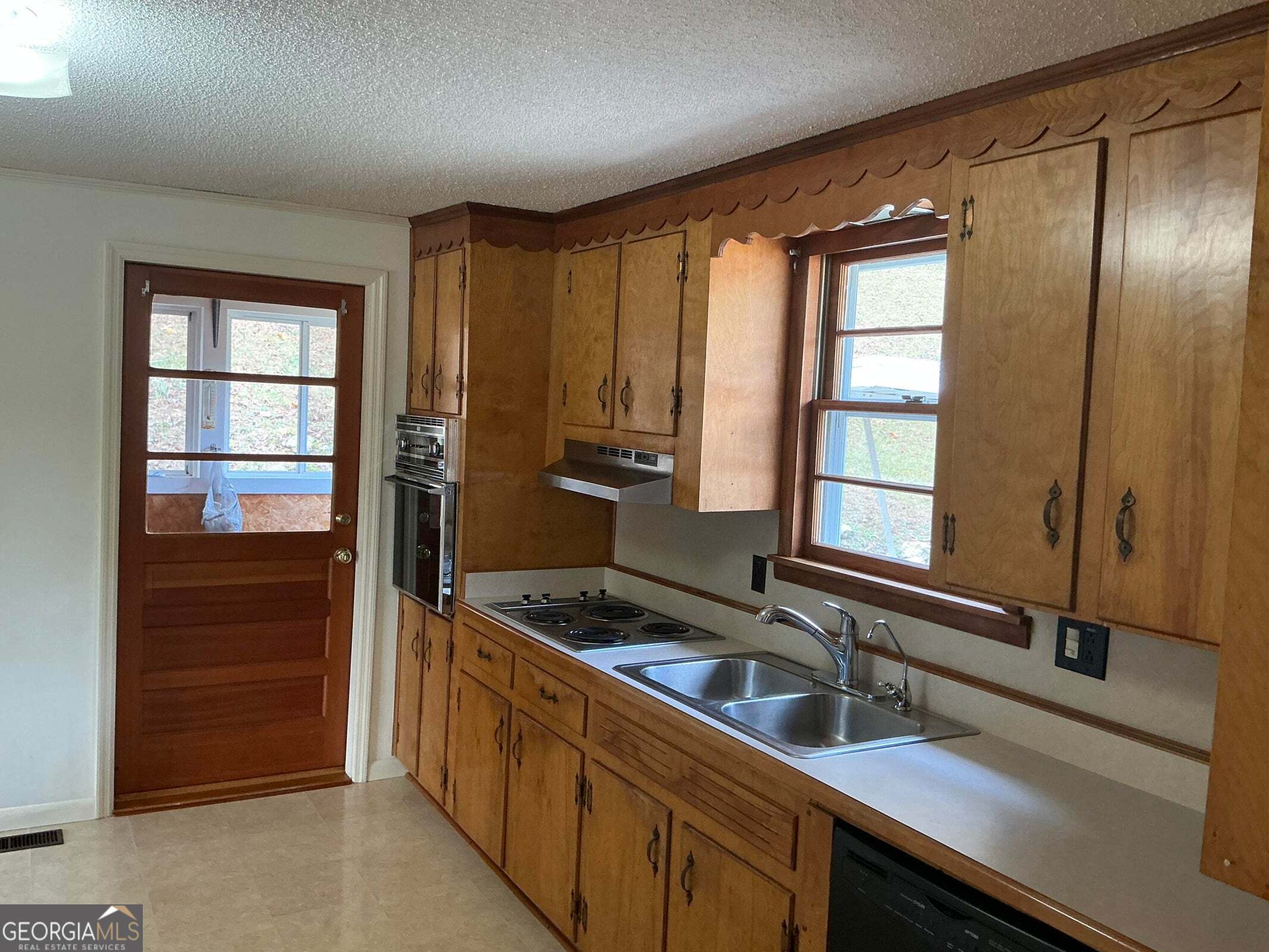 5062 B Highway Rock Spring, GA 30739 - Photo 12 of 19 a kitchen with a refrigerator and a sink