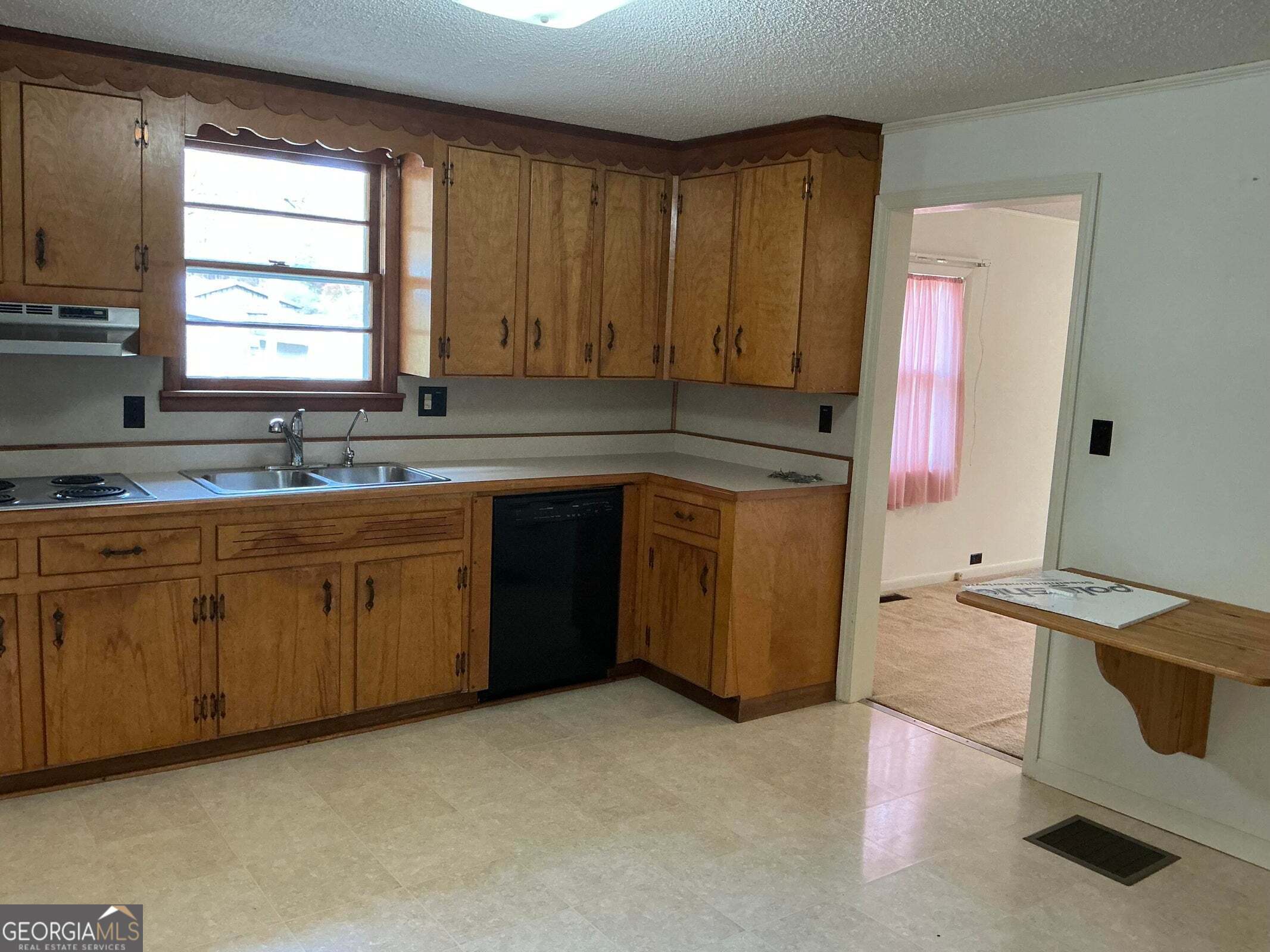 5062 B Highway Rock Spring, GA 30739 - Photo 2 of 19 a kitchen with a sink stove and cabinets