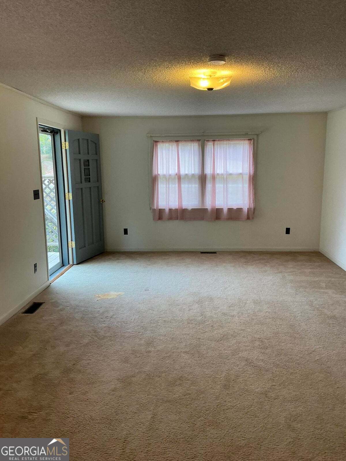 5062 B Highway Rock Spring, GA 30739 - Photo 3 of 19 a view of an empty room with a window
