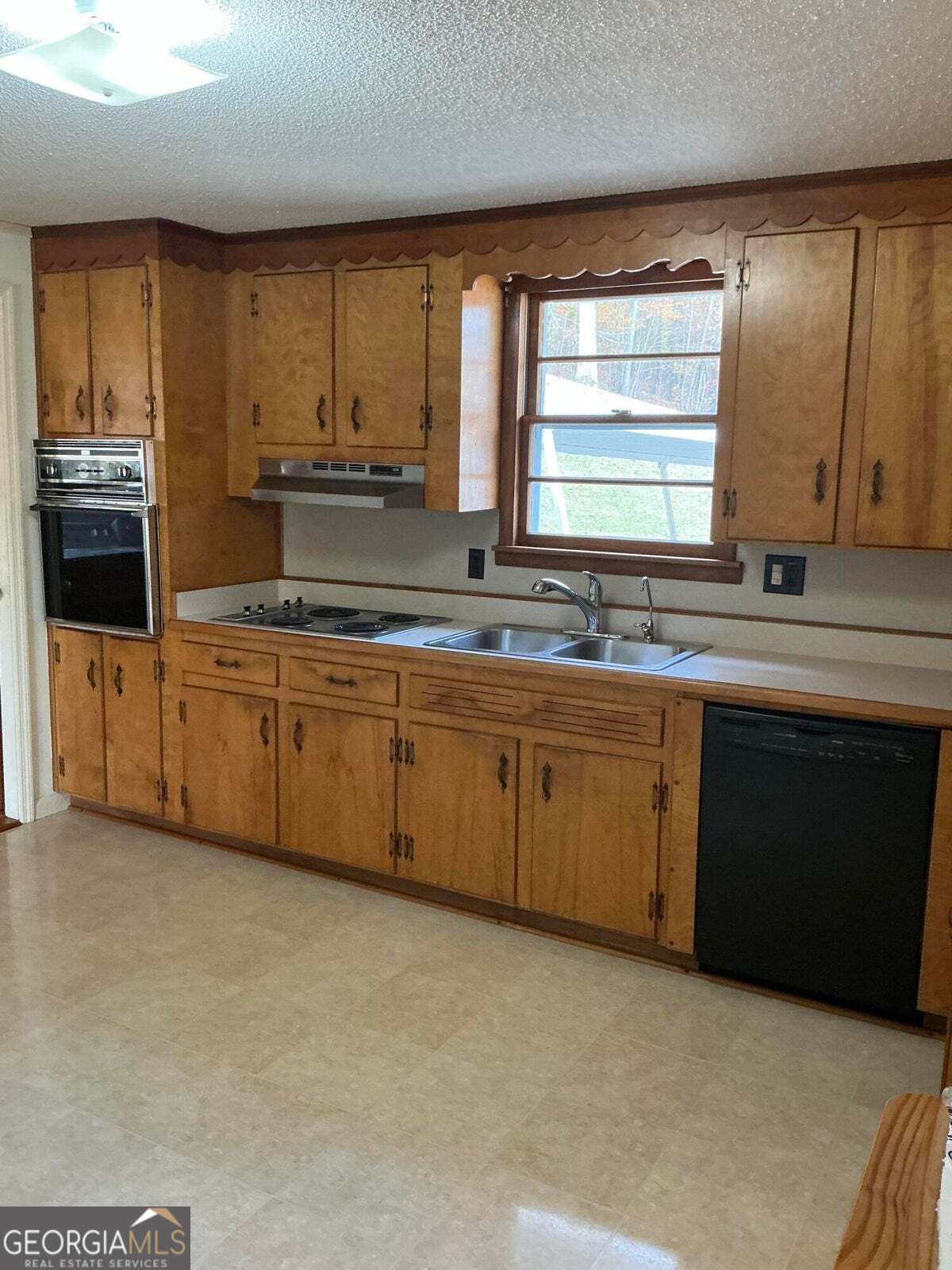 5062 B Highway Rock Spring, GA 30739 - Photo 6 of 19 a kitchen with stainless steel appliances a sink stove and cabinets