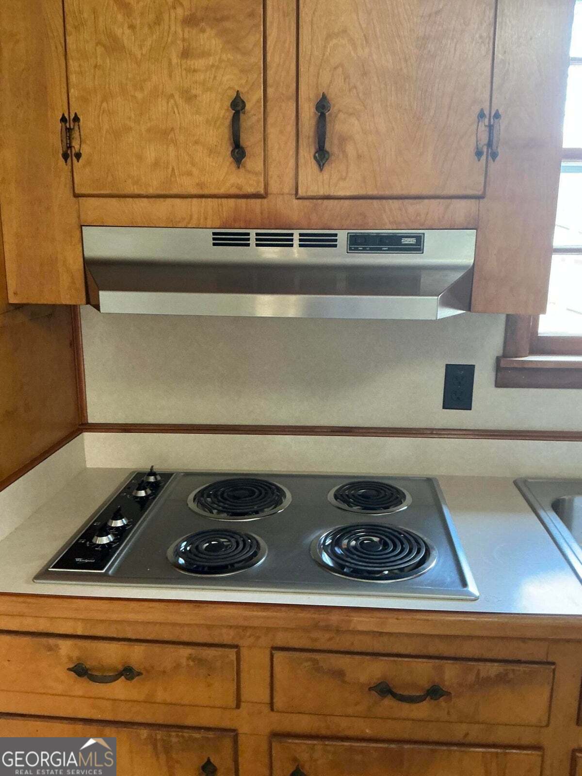 5062 B Highway Rock Spring, GA 30739 - Photo 7 of 19 a stove top oven sitting inside of a kitchen