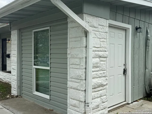a front view of a house with a shower