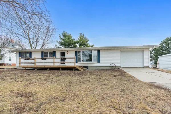 a house with trees in the background