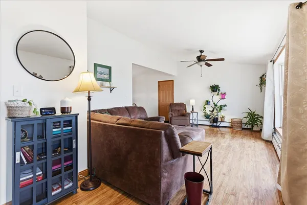 a living room with furniture and a mirror