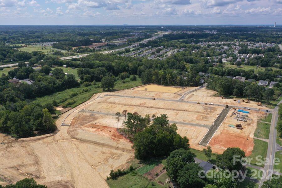 6043 Rizer Drive Charlotte, NC 28269 - Photo 4 of 4 an aerial view of residential houses with outdoor space