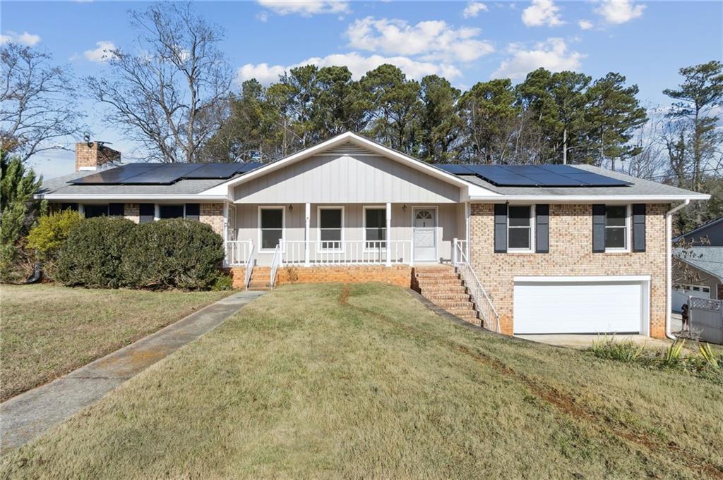 1987 Hill Road Marietta, GA 30062 - Photo 1 of 1 a house with trees in the background