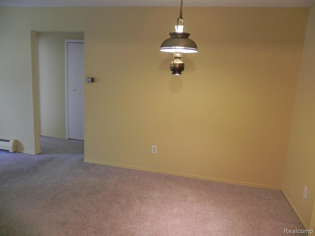 4905 Crooks Road, Unit 66 Royal Oak, MI 48073 - Photo 7 of 19 Living room is open to dining nook