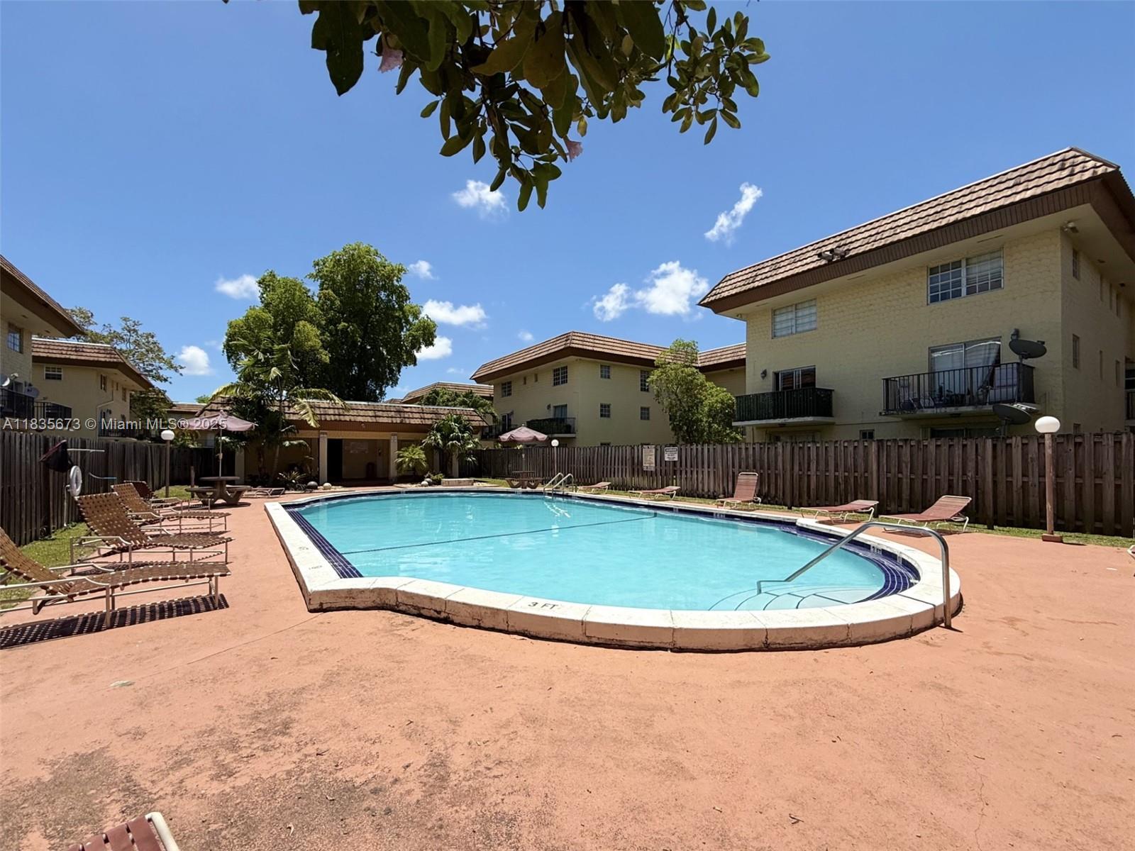 8650 Southwest 109th Avenue, Unit 3112 Miami, FL 33173 - Photo 37 of 38 Community Pool and Lounging Area View