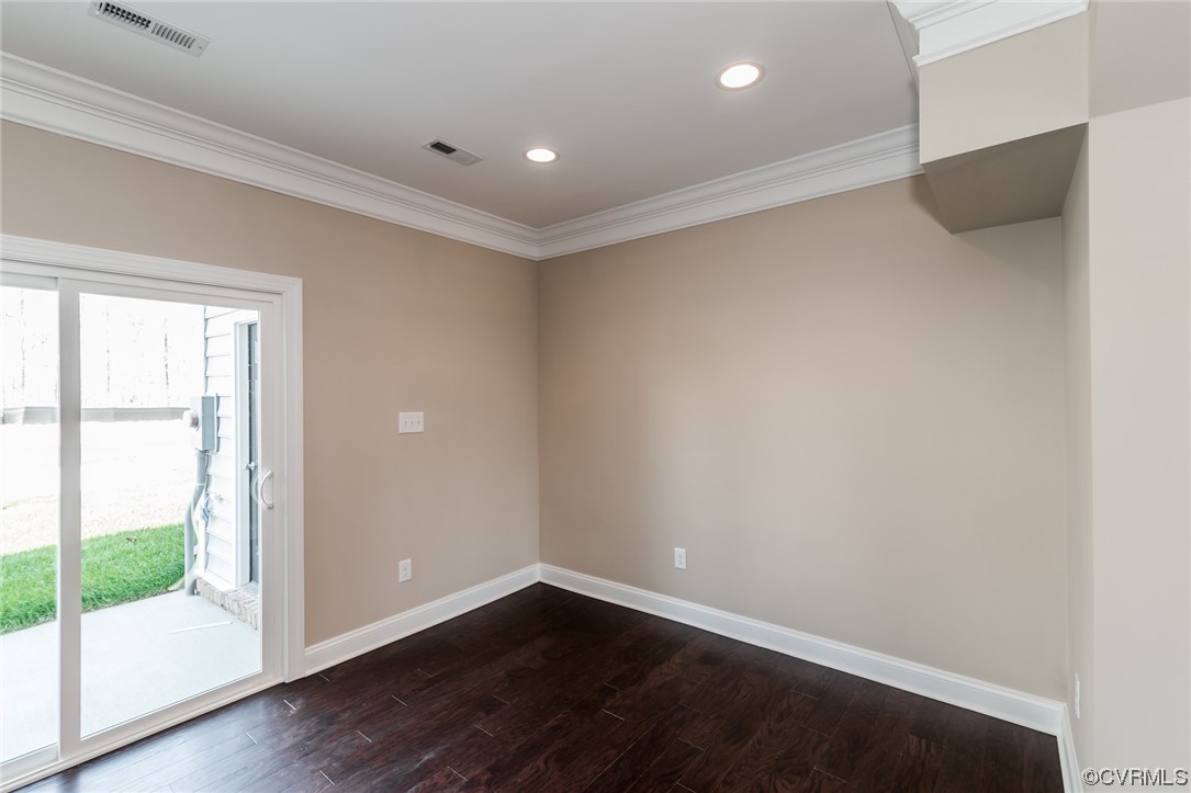 6173 Belay Drive Richmond, VA 23234 - Photo 4 of 17 a view of an empty room with wooden floor and a window