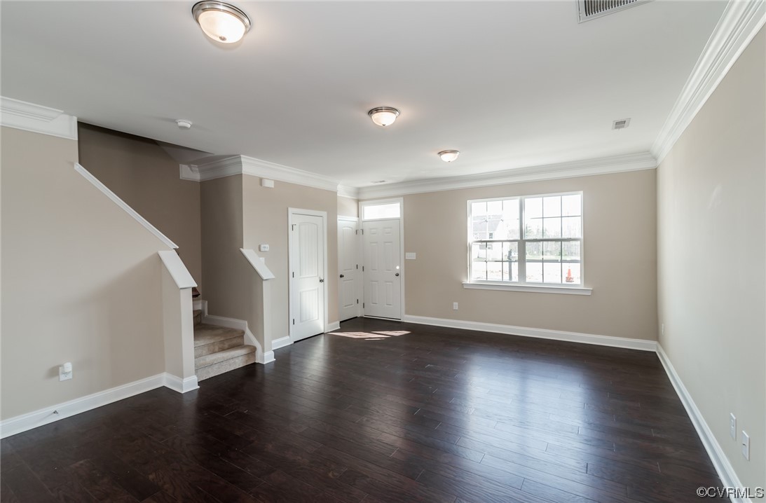 6173 Belay Drive Richmond, VA 23234 - Photo 5 of 17 a view of an empty room with wooden floor and a window