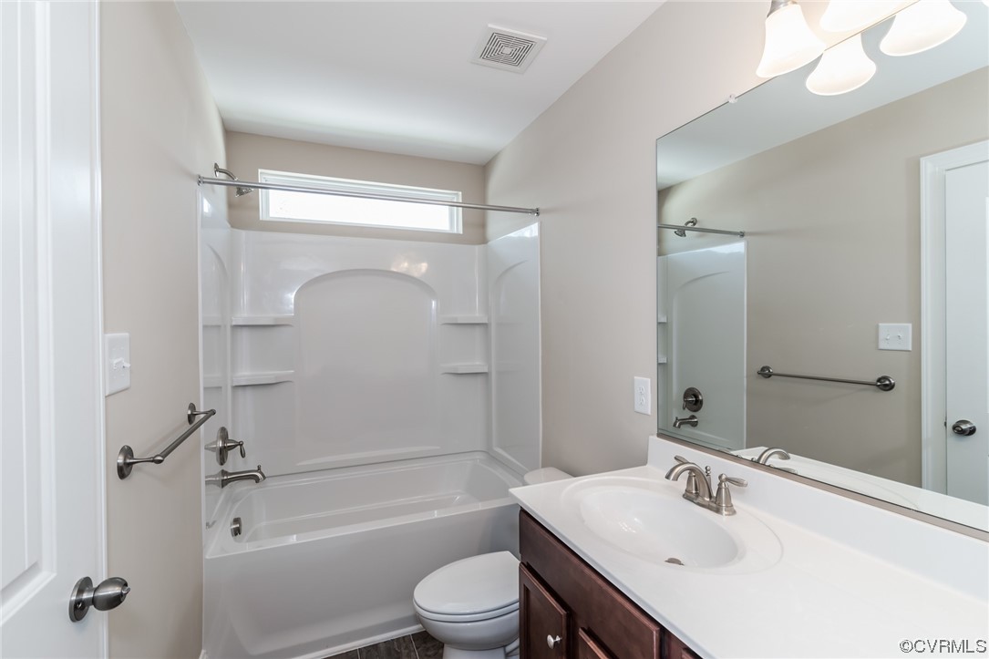 6173 Belay Drive Richmond, VA 23234 - Photo 10 of 17 a bathroom with a sink toilet tub and shower