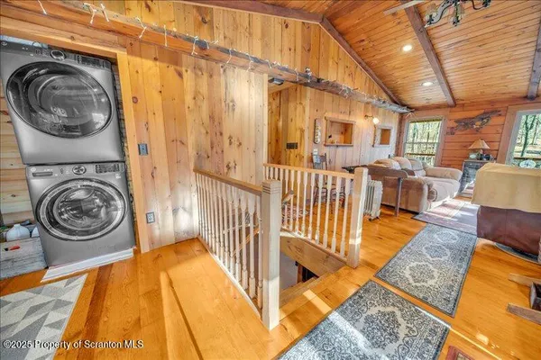 a view of a bedroom with washer and dryer
