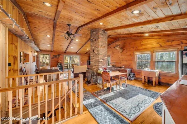 a living room with lots of furniture and a rug