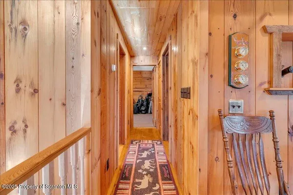 a bed sitting in a spacious bedroom next to a window