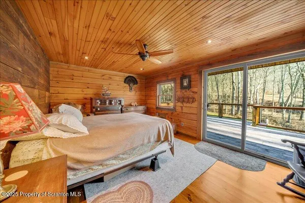 a bed room with a bed and a large window