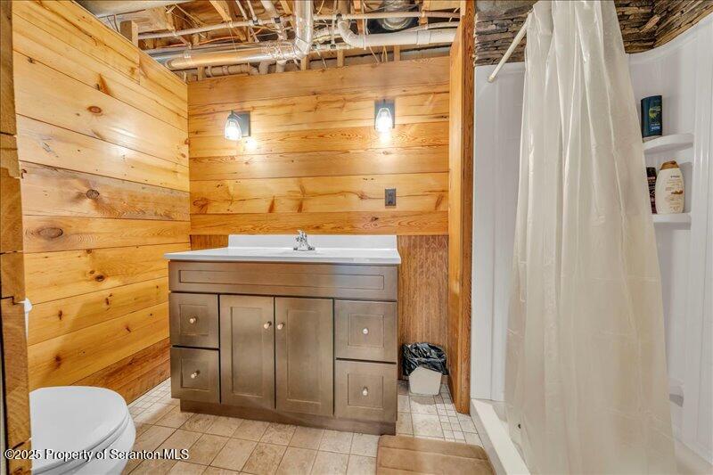 1338 Whites Ferry Road Falls, PA 18615 - Photo 21 of 46 a bathroom with a sink toilet and shower
