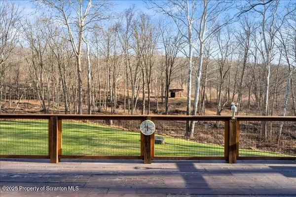 a view of a house with wooden deck