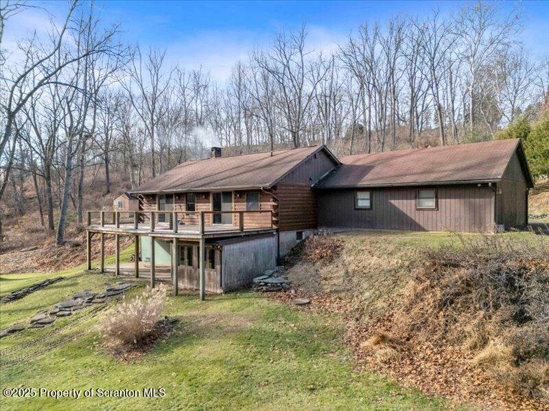 1338 Whites Ferry Road Falls, PA 18615 - Photo 38 of 46 a view of a house with a yard and sitting area