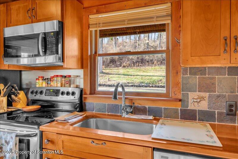 1338 Whites Ferry Road Falls, PA 18615 - Photo 5 of 46 a kitchen with a stove and a sink