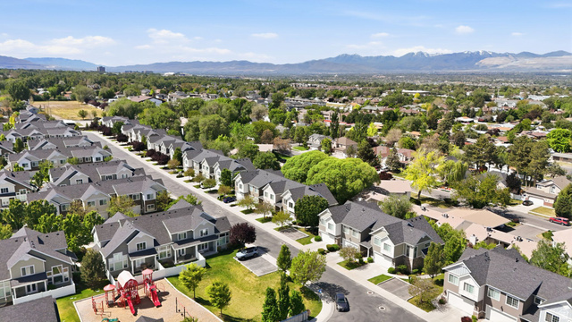 7872 Farm House Lane Midvale, UT 84047 - Photo 36 of 39 Aerial perspective showcasing a residential community with uniform architectural styles and mature landscaping