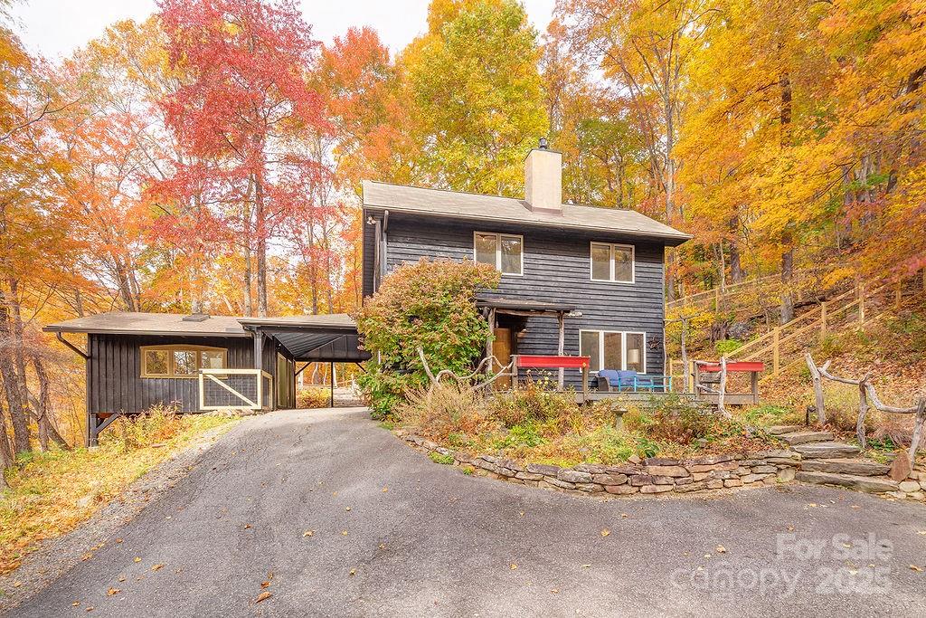 48 Black Oak Forest Road Fairview, NC 28730 - Photo 2 of 48 a front view of a house with garage