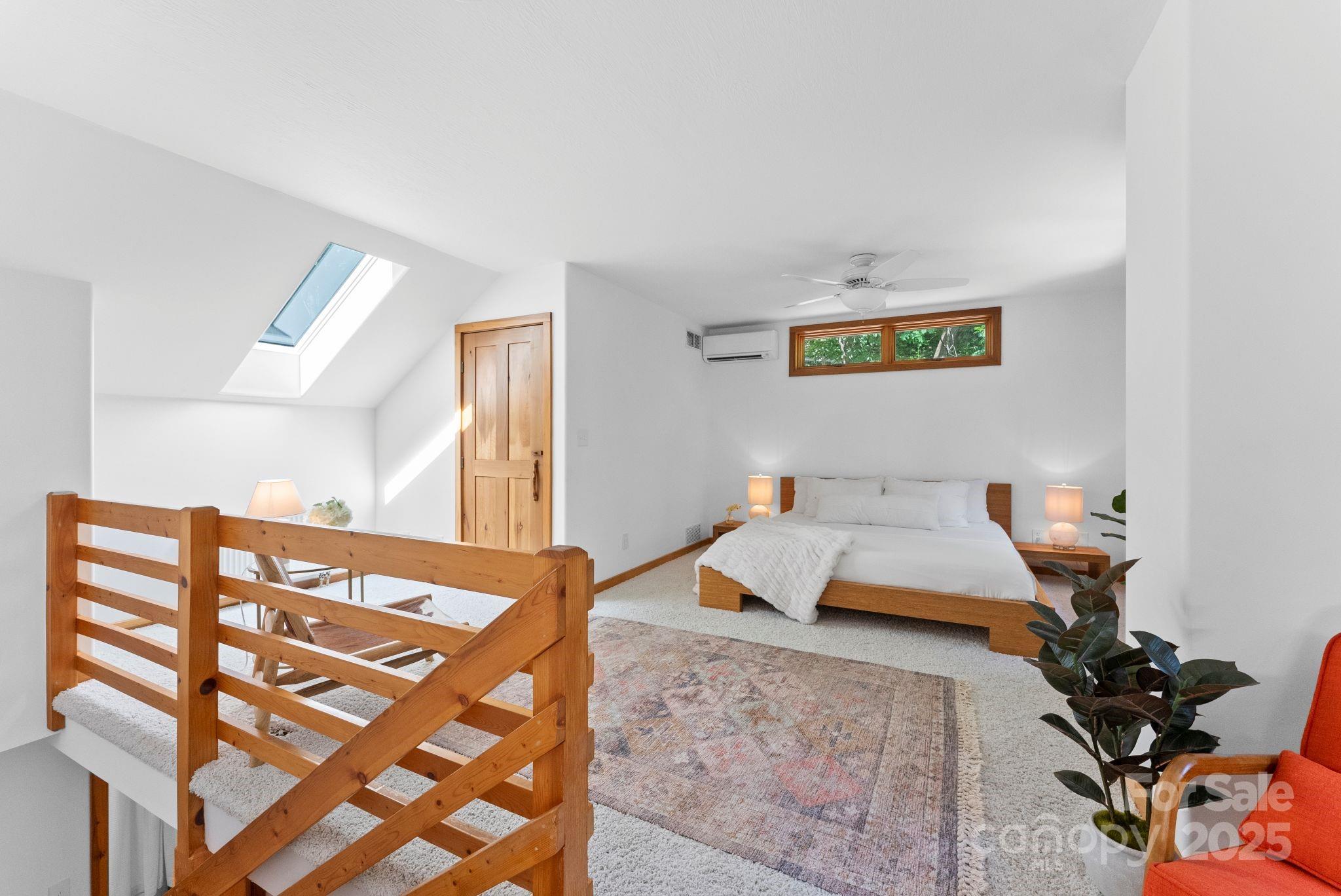48 Black Oak Forest Road Fairview, NC 28730 - Photo 23 of 48 a bedroom with a bed and a dresser