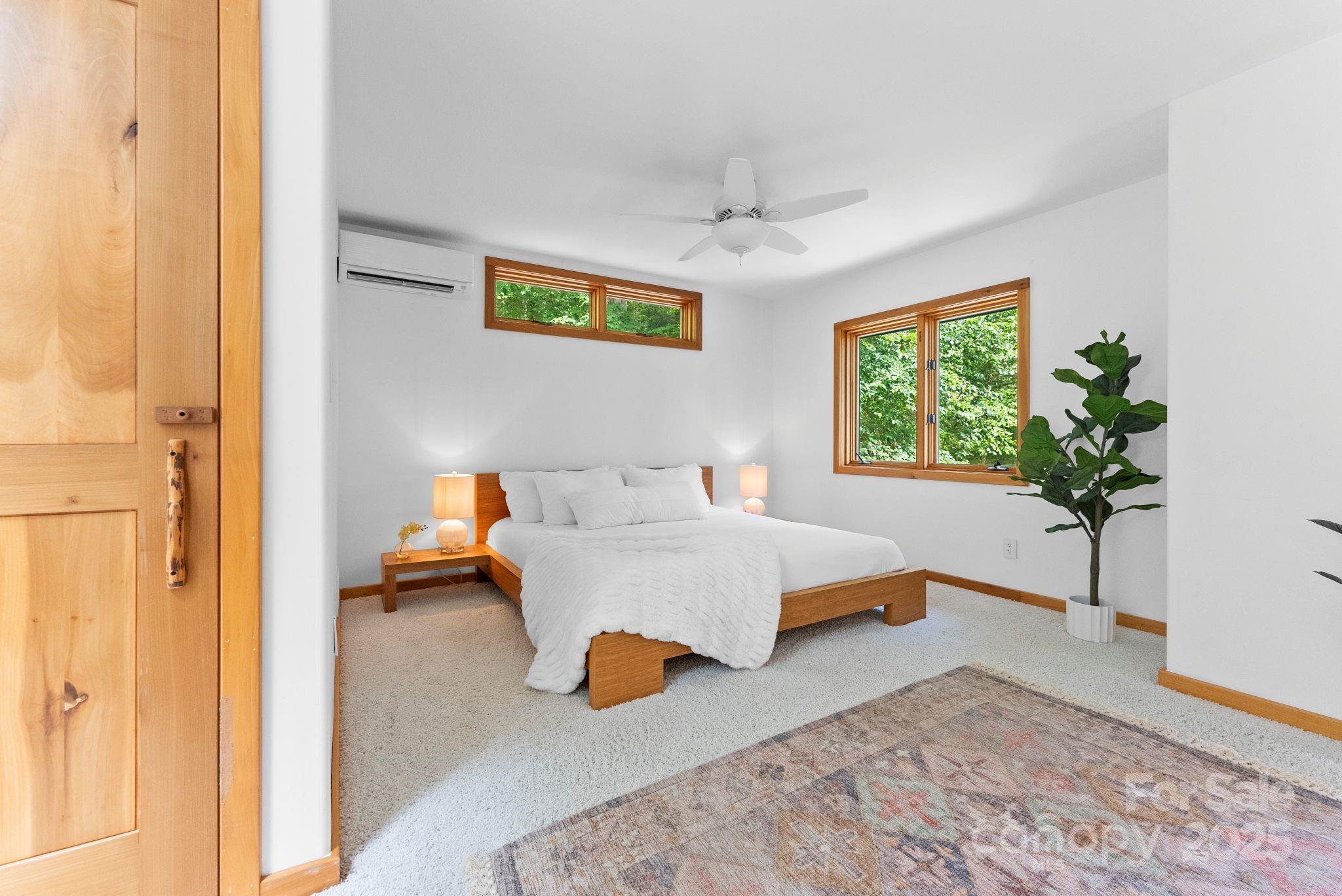 48 Black Oak Forest Road Fairview, NC 28730 - Photo 27 of 48 a living room with furniture and a potted plant