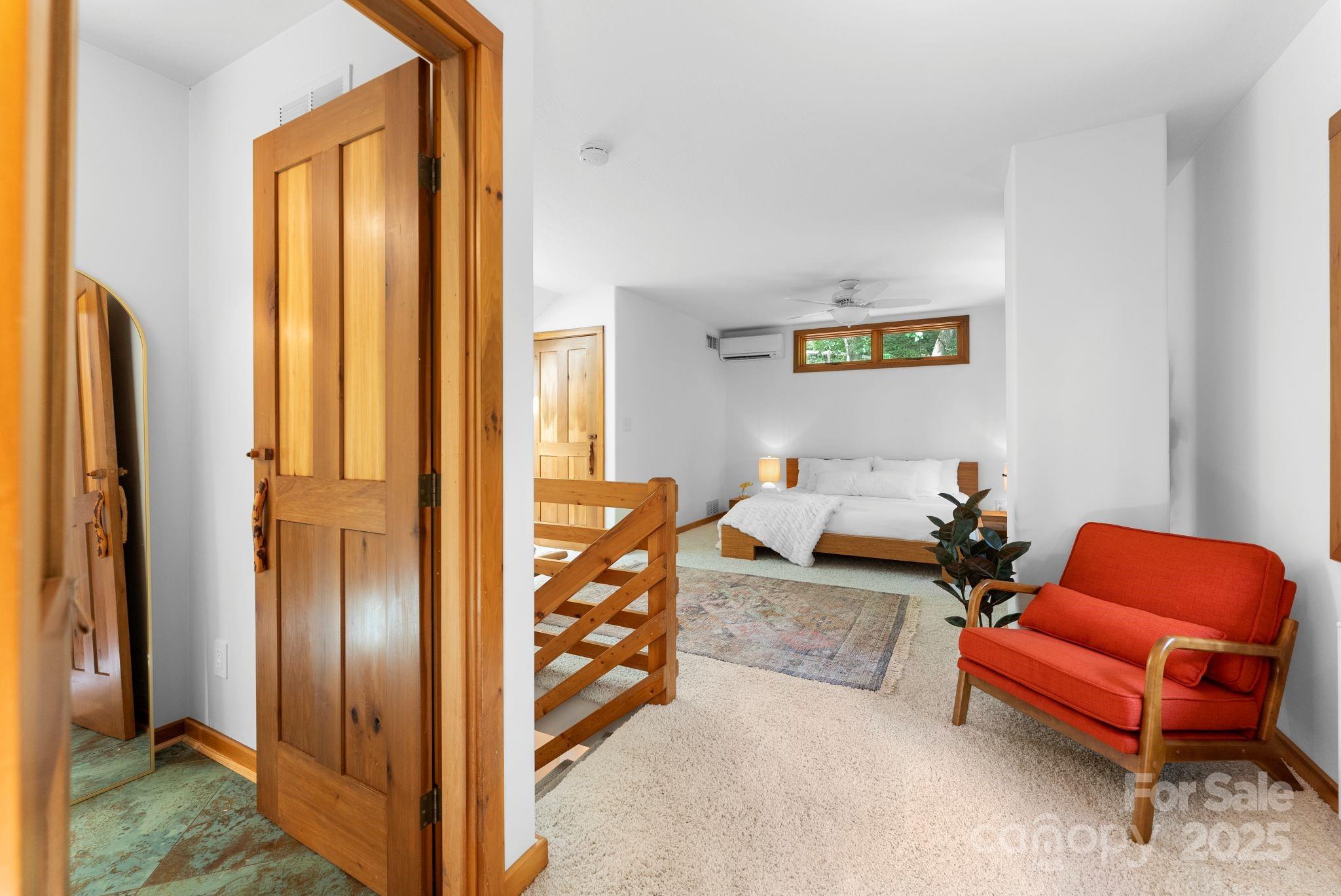 48 Black Oak Forest Road Fairview, NC 28730 - Photo 29 of 48 a bed room with a bed and a chair