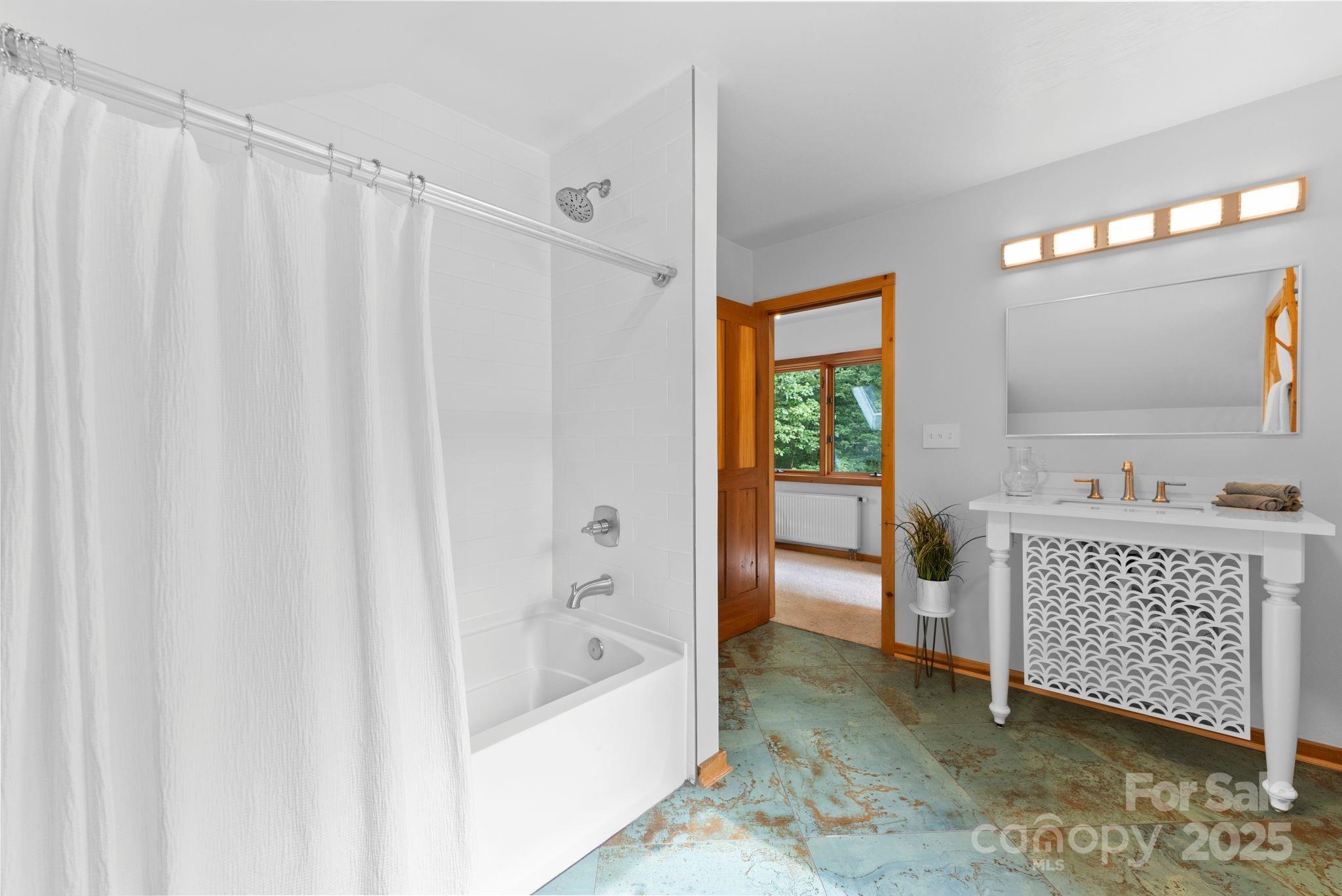 48 Black Oak Forest Road Fairview, NC 28730 - Photo 31 of 48 a bathroom with a bathtub and a sink