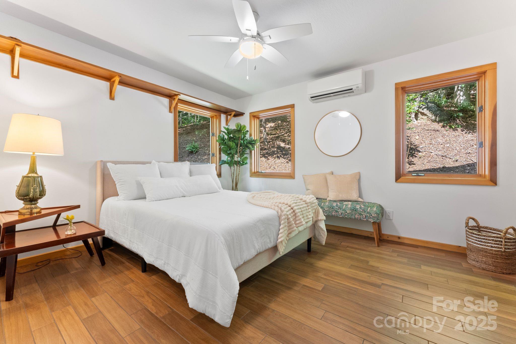 48 Black Oak Forest Road Fairview, NC 28730 - Photo 33 of 48 a bed room with a bed and a lamp